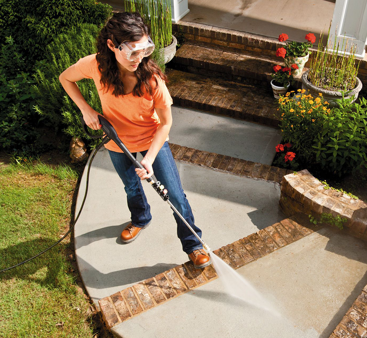 woman cleaning concrete